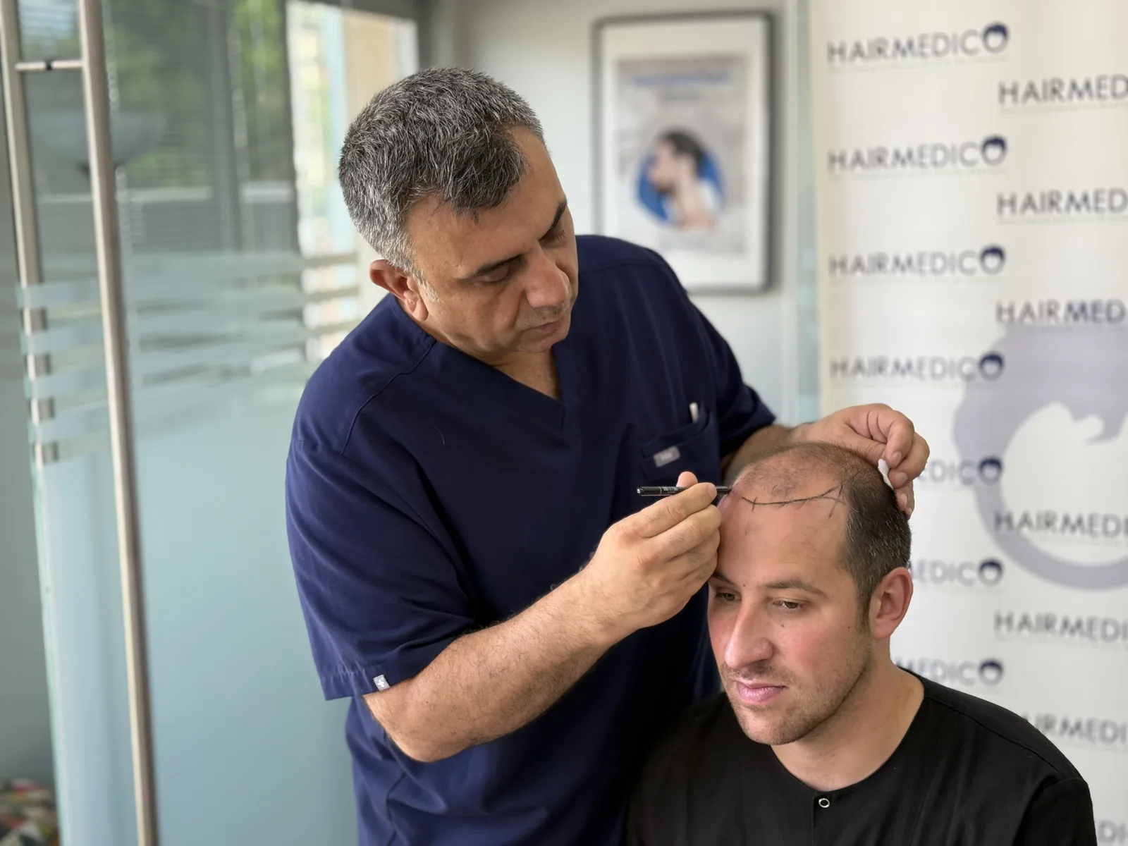 Dr. Arslan Musbeh during a hairline consultation at the Hairmedico clinic in Istanbul