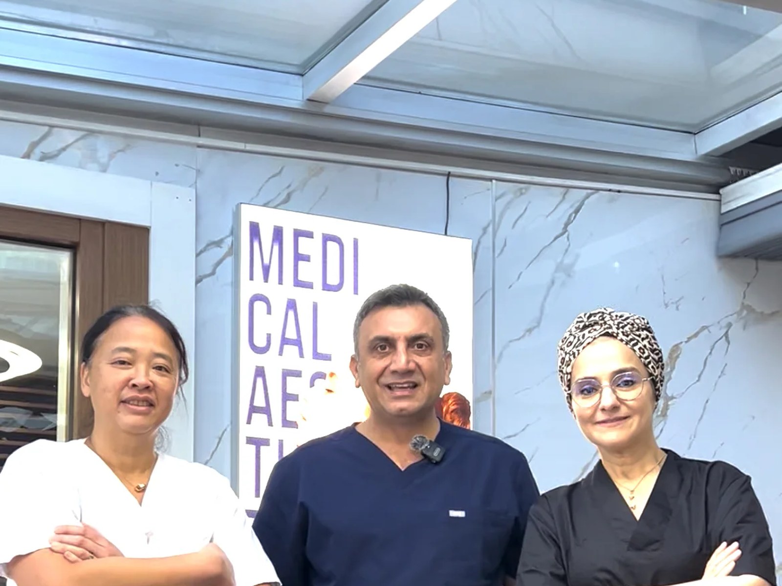 Hairmedico team with a patient in the clinic patient area