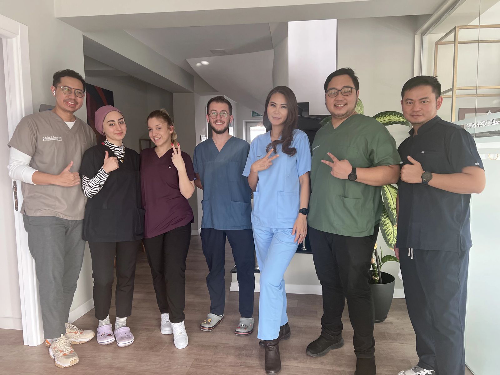 Hairmedico team with a patient in the clinic patient area