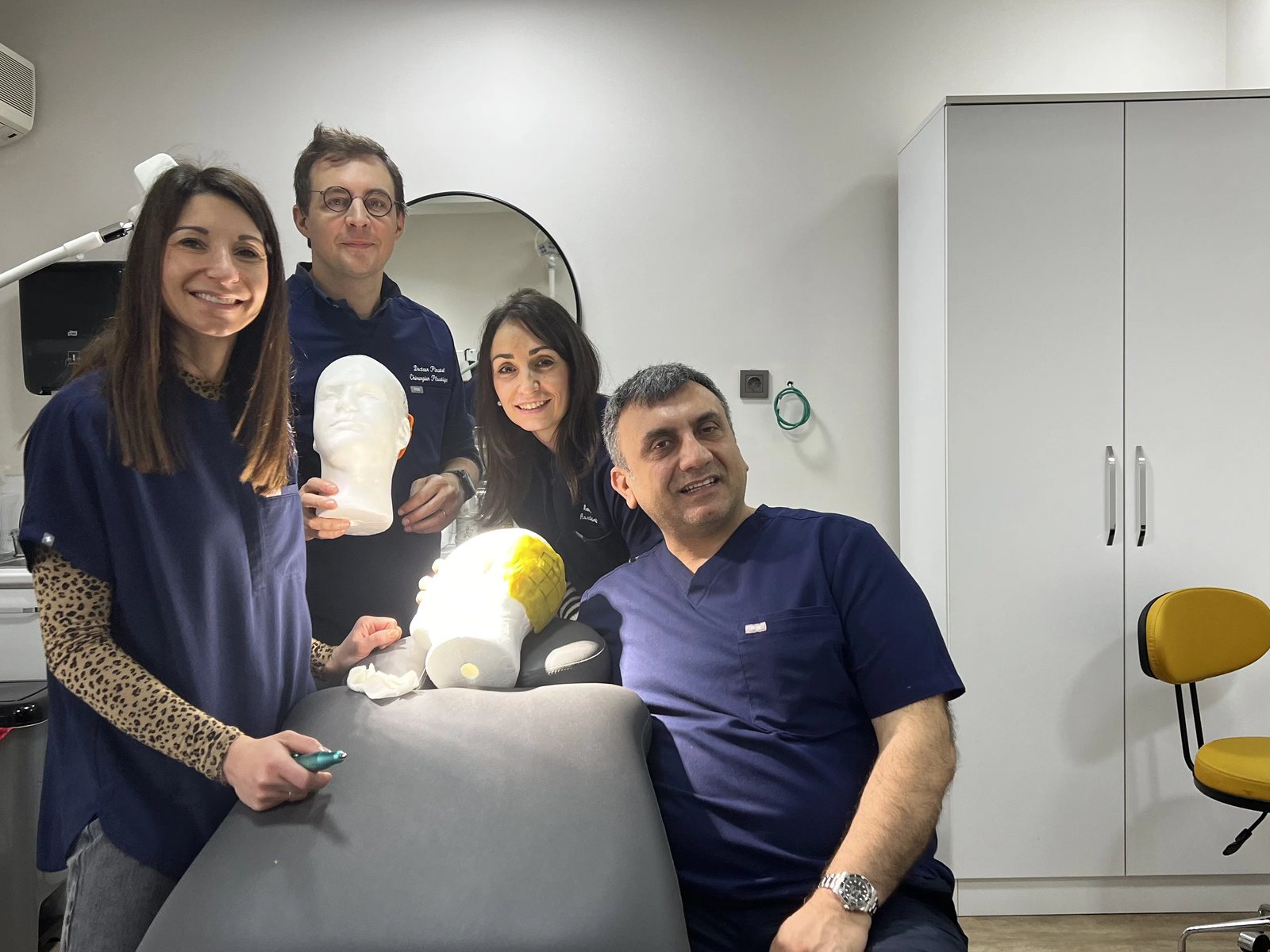 Hairmedico team with a patient in the clinic patient area