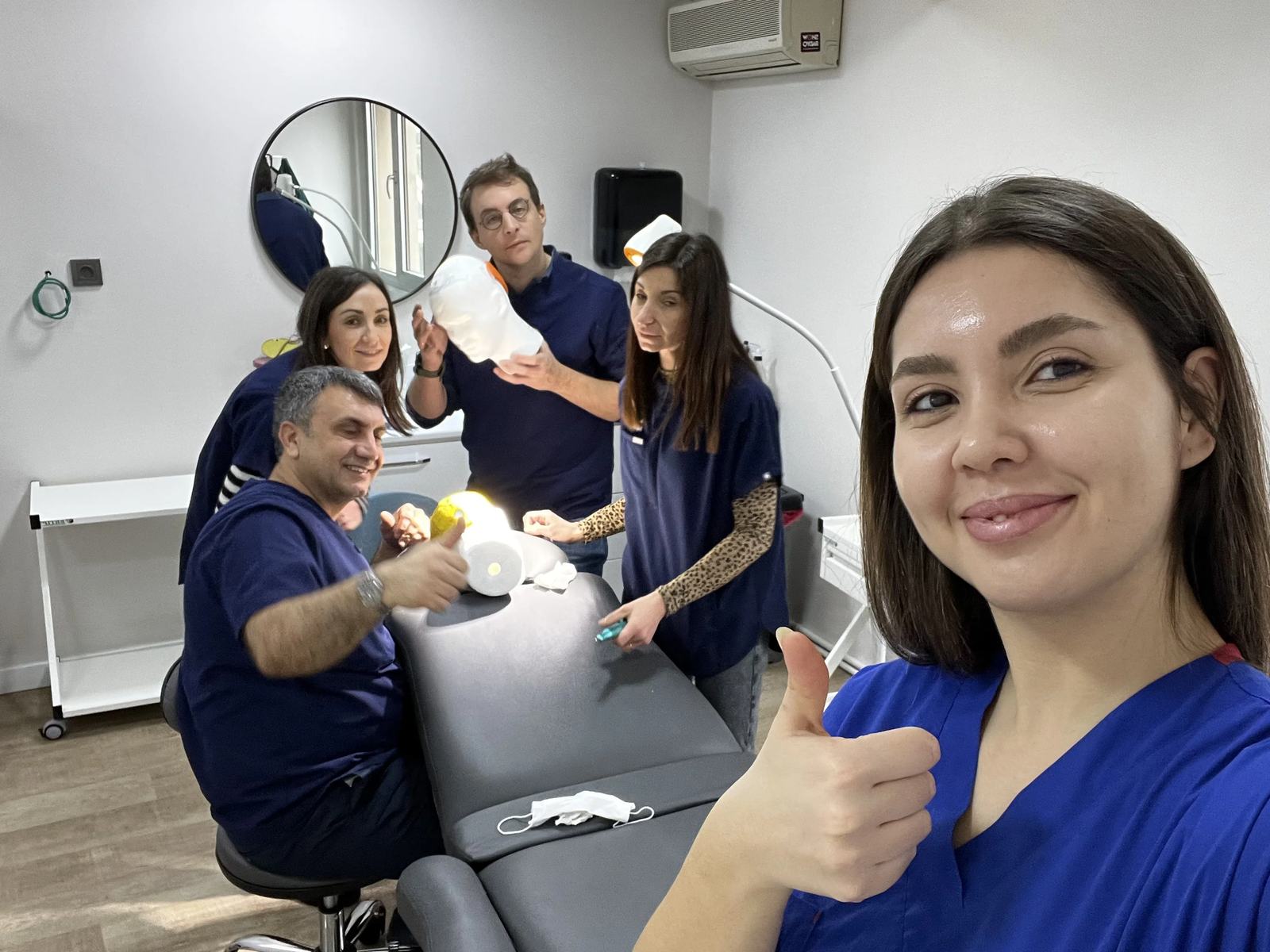 Hairmedico team with a patient in the clinic patient area